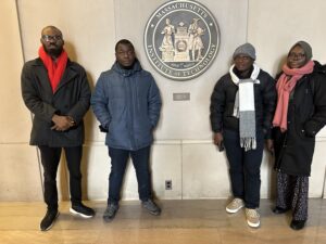 Photograph of the A3 participants in front of the MIT seal