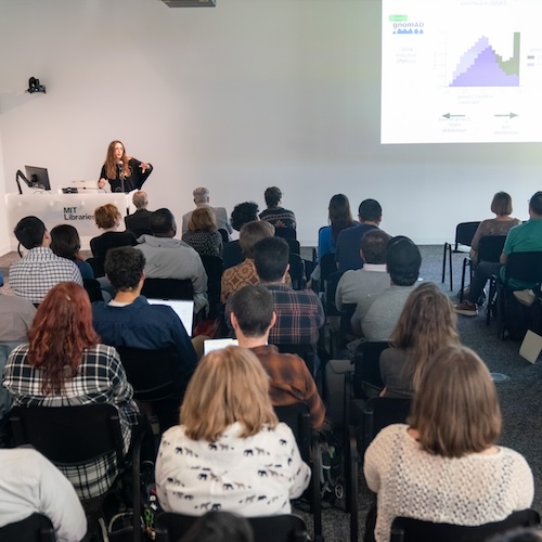 Undergraduate student Hannah Jacobs presents her open data project before an audience in the Nexus